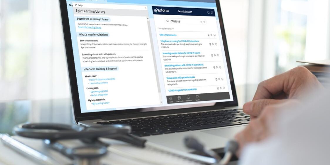 Physician working on laptop with uPerform's Epic in-app training