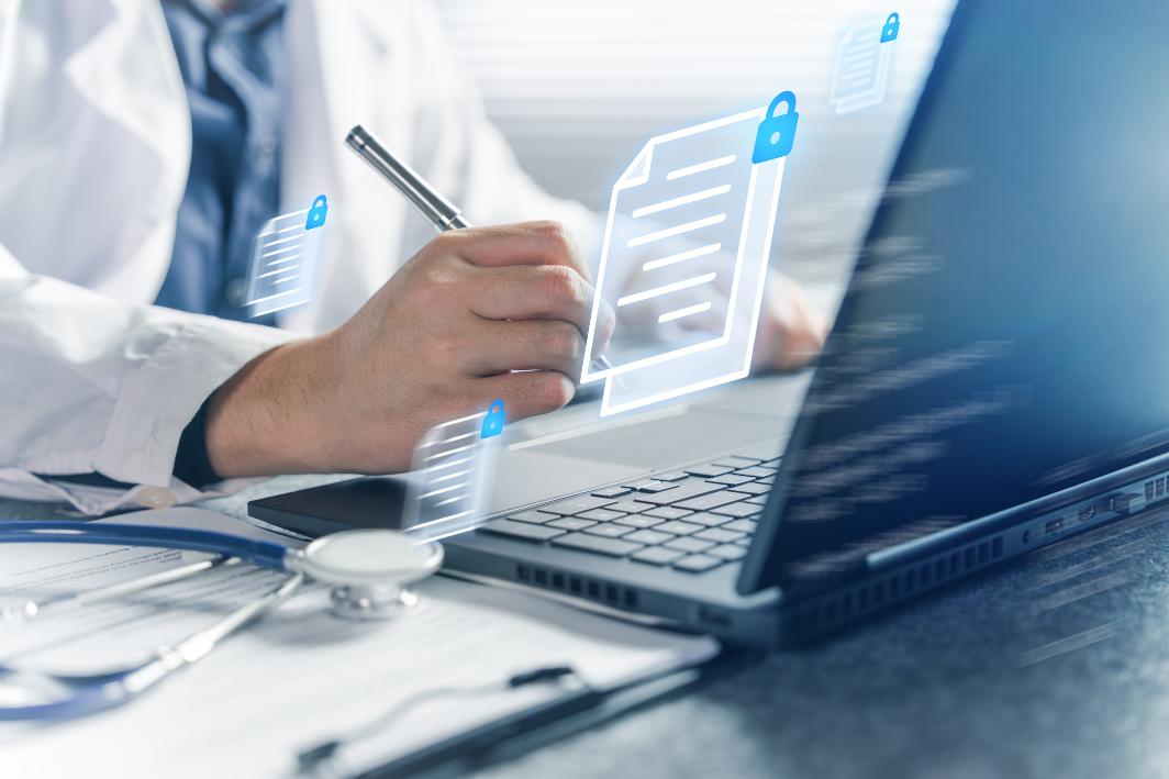 image Clinician reviewing a secure digital document on a laptop, representing secure communication in healthcare EHR workflows